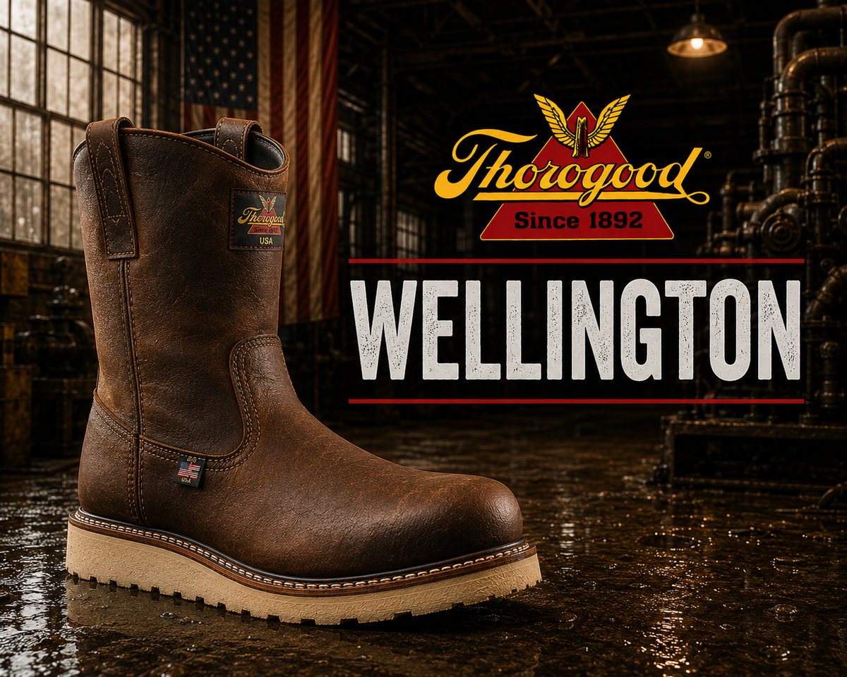 A brown leather pull-on wellington work boot with dual pull straps on a wedge outsole.