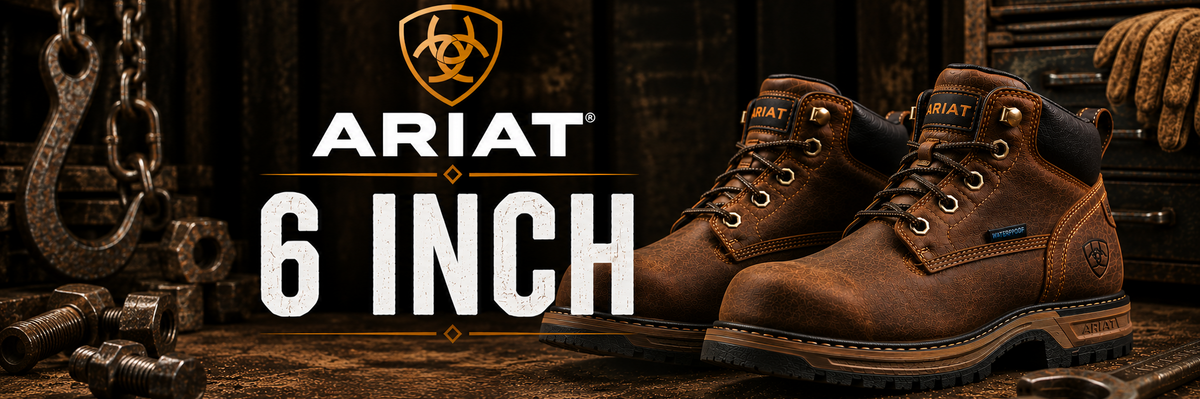 Pair of Ariat 6-inch work boots in brown leather, displayed on a rustic wooden workbench with heavy machinery and tools in the background.